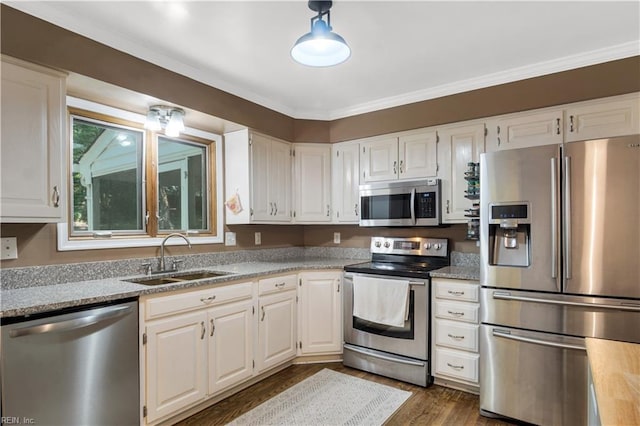 6 Hastings Ln, Williamsburg, VA 23188 - kitchen with appliances with stainless steel finishes, a sink, white cabinets, dark wood-style flooring, and ornamental molding