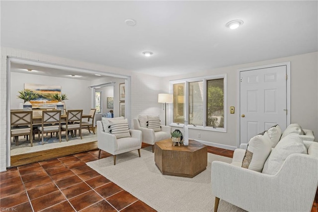 living area featuring dark tile patterned floors