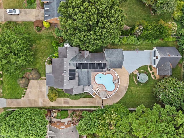 aerial view of property and surrounding area with a pool