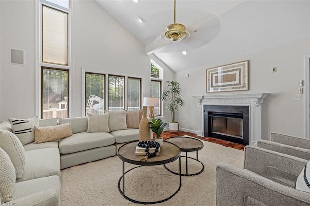 living area with a fireplace with flush hearth, ceiling fan, high vaulted ceiling, recessed lighting, and wood finished floors