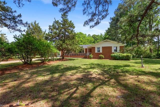 7709 S Quay Rd, Suffolk, VA 23437 - view of green lawn with a porch