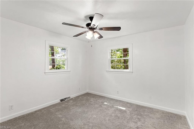7709 S Quay Rd, Suffolk, VA 23437 - empty room featuring plenty of natural light, carpet, baseboards, and ceiling fan