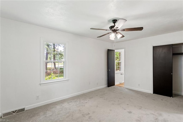 7709 S Quay Rd, Suffolk, VA 23437 - unfurnished bedroom with carpet floors, baseboards, and a ceiling fan