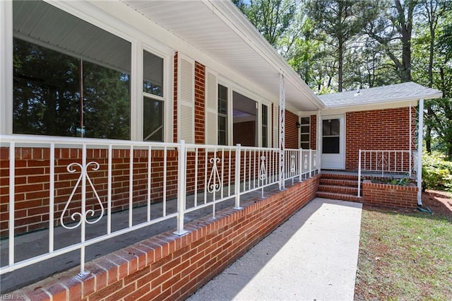 7709 S Quay Rd, Suffolk, VA 23437 - view of home's exterior with covered porch and brick siding