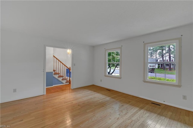 5 Bessies Landing Dr, Poquoson, VA 23662 - unfurnished living room featuring stairway and light wood-type flooring