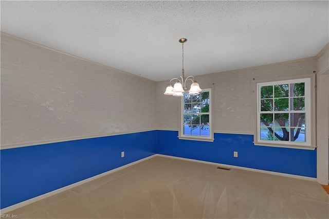 5 Bessies Landing Dr, Poquoson, VA 23662 - spare room featuring a textured ceiling, a chandelier, carpet floors, and baseboards