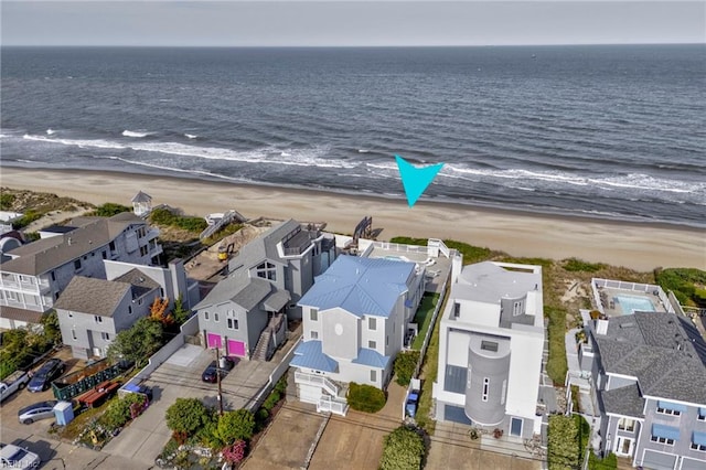 aerial view of residential area featuring expansive coastline