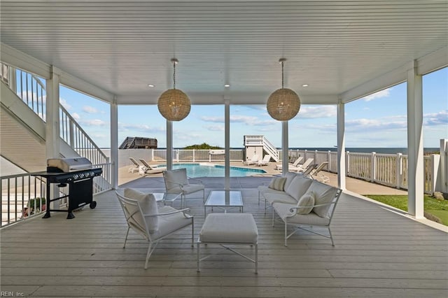 deck with outdoor lounge area and area for grilling