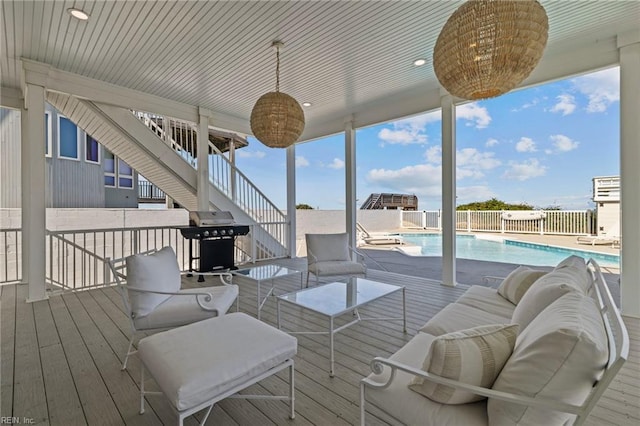 deck with stairway, a grill, and fence