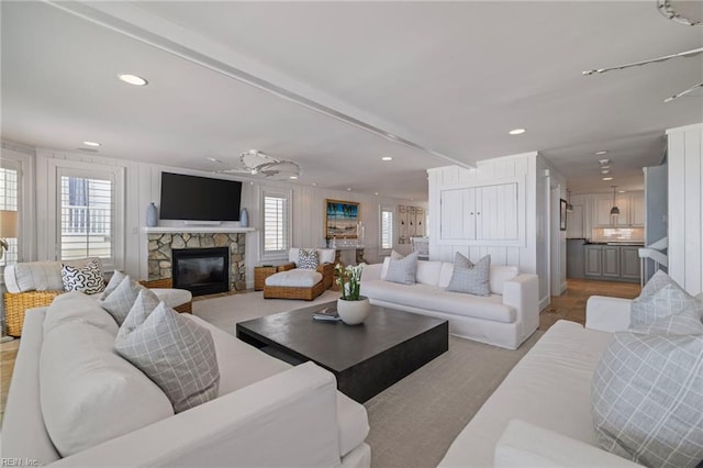 living area featuring a fireplace and recessed lighting