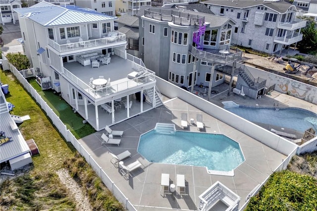 aerial perspective of suburban area featuring a pool area