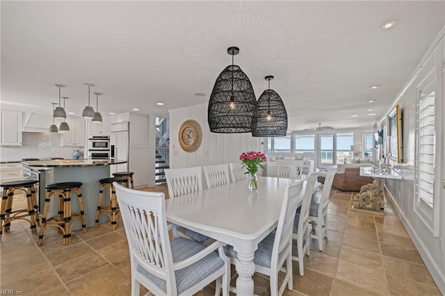 dining room featuring recessed lighting, stairway, and light tile patterned flooring