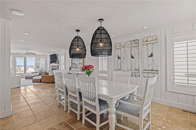 dining space featuring recessed lighting and baseboards