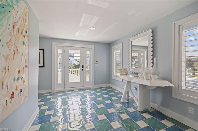foyer featuring baseboards