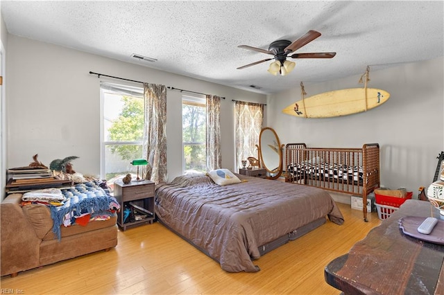 3667 Smokey Chamber Dr, Virginia Beach, VA 23462 - bedroom featuring a textured ceiling, wood finished floors, and ceiling fan