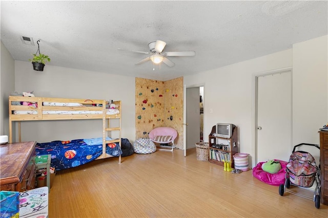 3667 Smokey Chamber Dr, Virginia Beach, VA 23462 - bedroom with wood finished floors, a textured ceiling, and a ceiling fan