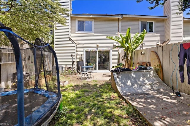 3667 Smokey Chamber Dr, Virginia Beach, VA 23462 - back of property with a trampoline, a fenced backyard, and a patio