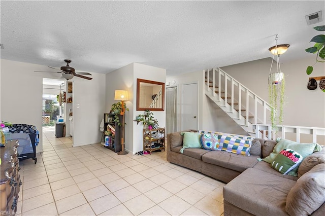 3667 Smokey Chamber Dr, Virginia Beach, VA 23462 - living room featuring a textured ceiling, light tile patterned flooring, stairway, and a ceiling fan