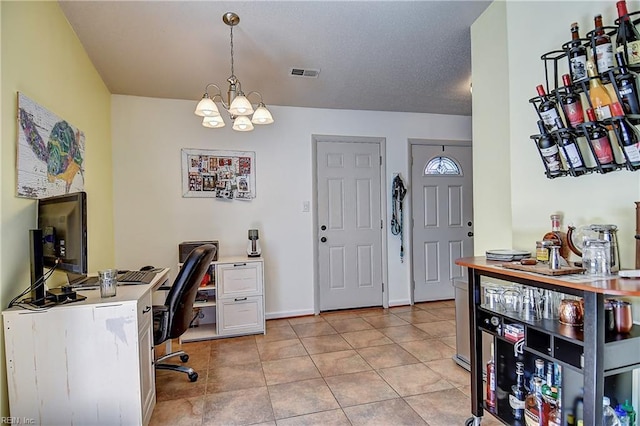 office with a chandelier, light tile patterned flooring, and baseboards