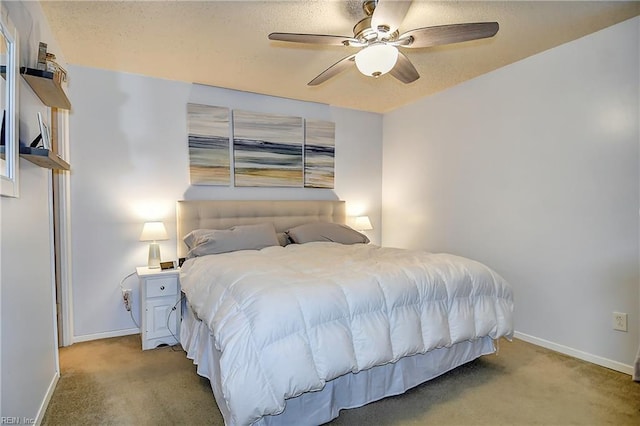 bedroom with carpet, baseboards, and a ceiling fan