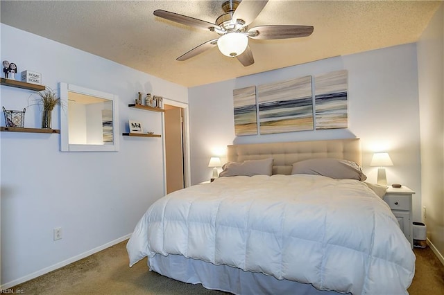 carpeted bedroom featuring baseboards, a textured ceiling, and ceiling fan