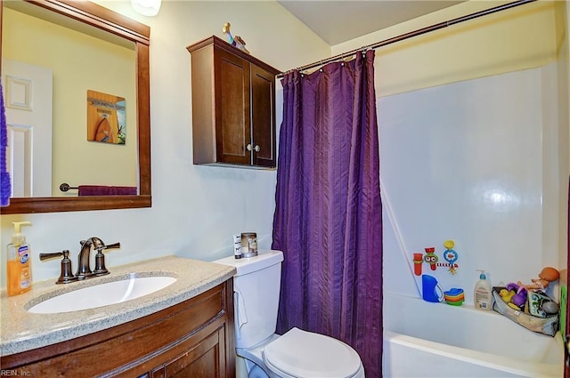 bathroom featuring toilet, vanity, and shower / bath combination with curtain