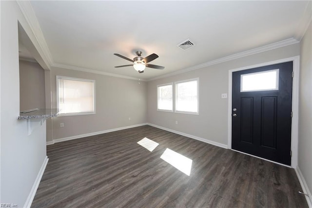 foyer featuring baseboards, dark wood-type flooring, ornamental molding, and ceiling fan