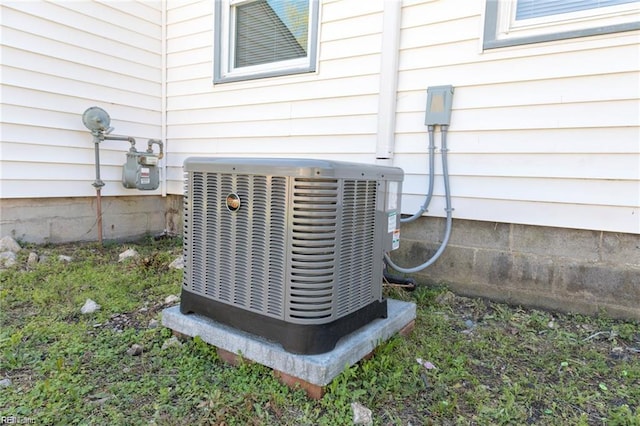 exterior view of central air condition unit and gas meter