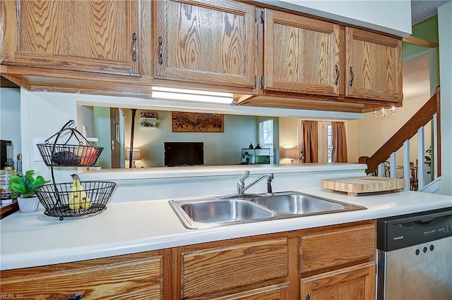 841 Masters Trl, Newport News, VA 23602 - kitchen featuring stainless steel dishwasher, a sink, light countertops, and brown cabinets