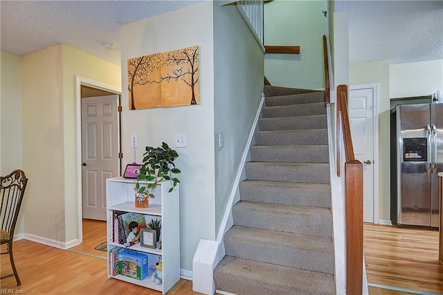 841 Masters Trl, Newport News, VA 23602 - stairway with wood finished floors, a textured ceiling, and baseboards