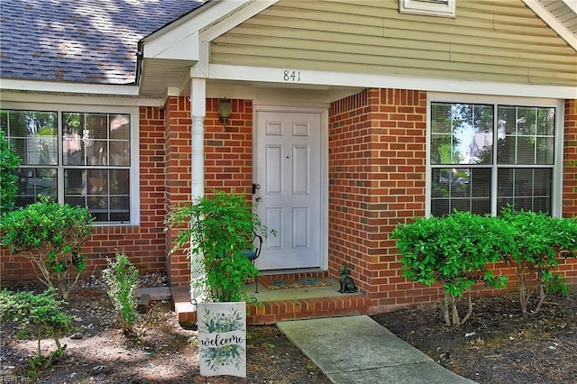 841 Masters Trl, Newport News, VA 23602 - property entrance featuring brick siding and roof with shingles