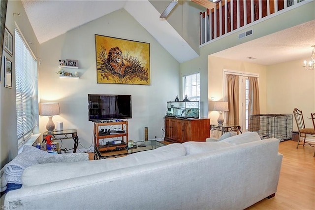 841 Masters Trl, Newport News, VA 23602 - living area featuring wood finished floors, high vaulted ceiling, ceiling fan, and a chandelier