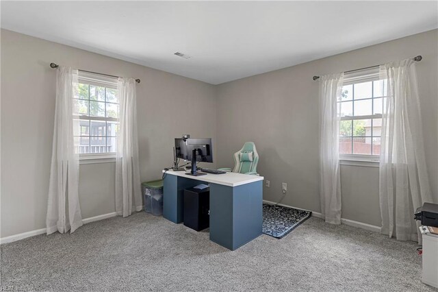office area with light carpet and baseboards