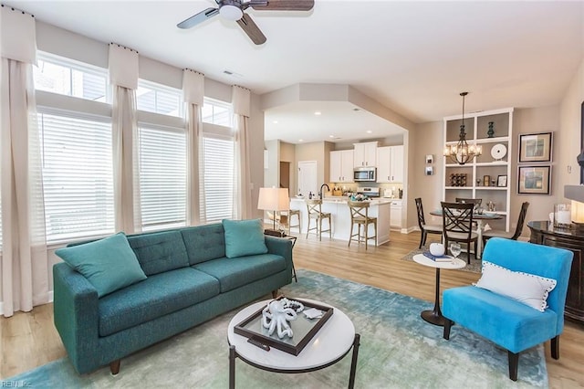 2000 Venture Way Unit B, Suffolk, VA 23434 - living room with light wood-style flooring, a ceiling fan, a chandelier, and recessed lighting
