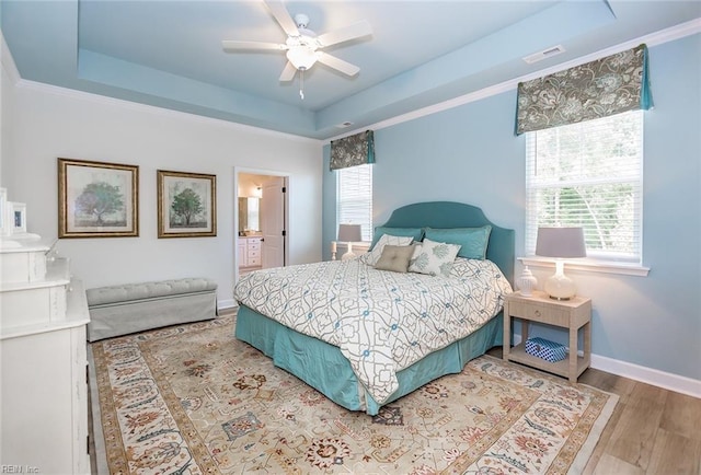 2000 Venture Way Unit B, Suffolk, VA 23434 - bedroom with a raised ceiling, wood finished floors, baseboards, connected bathroom, and a ceiling fan