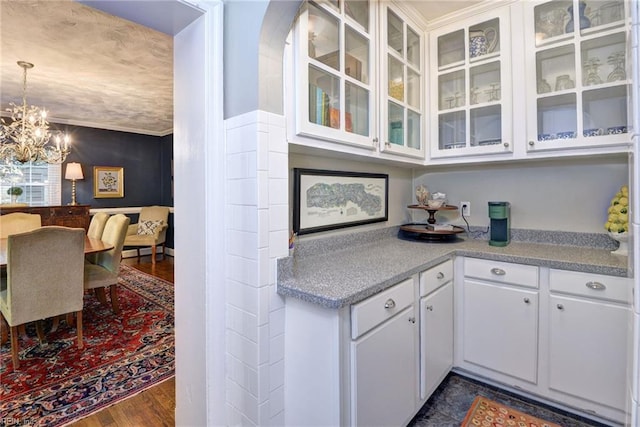 21 Westover Rd, Newport News, VA 23601 - bar area with a chandelier, dark wood-type flooring, and pendant lighting