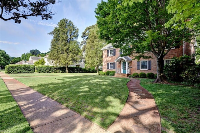 21 Westover Rd, Newport News, VA 23601 - view of front of house featuring brick siding and a front lawn