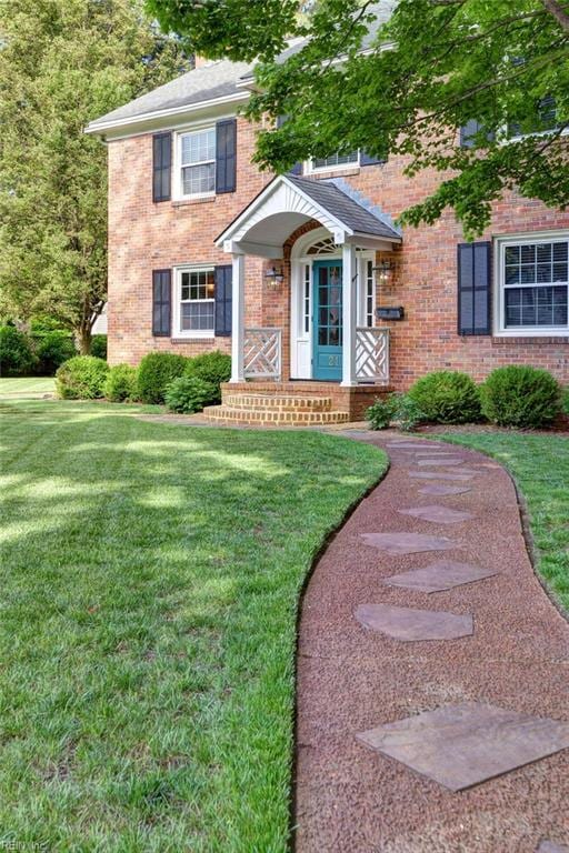 21 Westover Rd, Newport News, VA 23601 - view of front of home with brick siding and a front yard