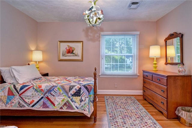 21 Westover Rd, Newport News, VA 23601 - bedroom featuring light wood finished floors, baseboards, and a chandelier