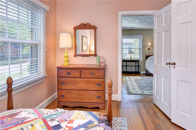 21 Westover Rd, Newport News, VA 23601 - bedroom with radiator, wood finished floors, and baseboards