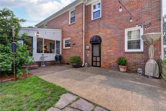 21 Westover Rd, Newport News, VA 23601 - rear view of property featuring brick siding and a patio area