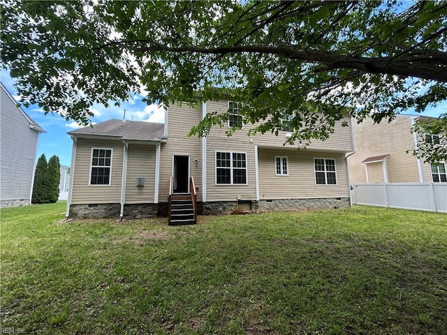 rear view of property with crawl space