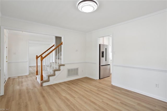 968 Speight Lyons Loop, Chesapeake, VA 23322 - empty room with light wood-type flooring, stairway, ornamental molding, and baseboards