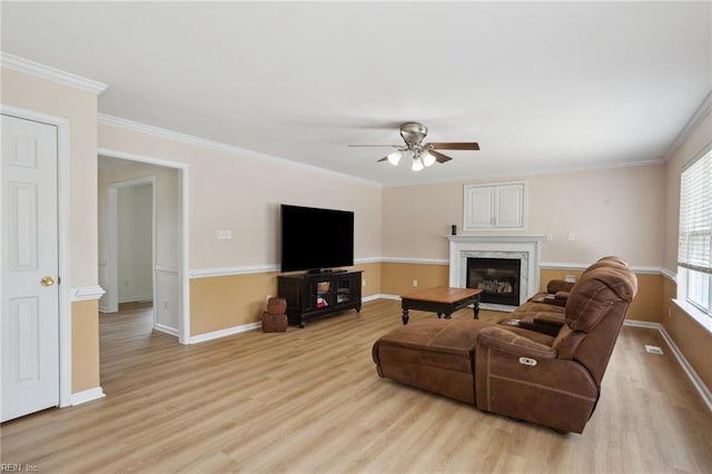 968 Speight Lyons Loop, Chesapeake, VA 23322 - living area featuring light wood-style floors, a ceiling fan, baseboards, a premium fireplace, and crown molding