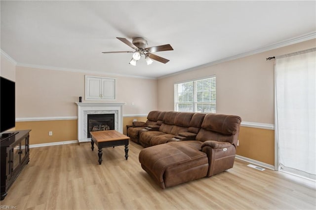 968 Speight Lyons Loop, Chesapeake, VA 23322 - living area with light wood-style flooring, ceiling fan, ornamental molding, baseboards, and a premium fireplace