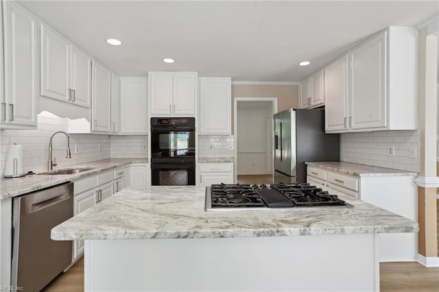 968 Speight Lyons Loop, Chesapeake, VA 23322 - kitchen with black appliances, a sink, white cabinets, tasteful backsplash, and recessed lighting