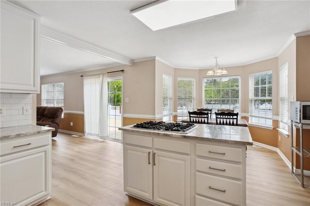 968 Speight Lyons Loop, Chesapeake, VA 23322 - kitchen with light wood-style floors, appliances with stainless steel finishes, a chandelier, baseboards, and crown molding
