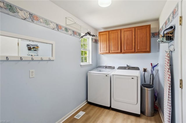 968 Speight Lyons Loop, Chesapeake, VA 23322 - laundry area with washing machine and clothes dryer, cabinet space, light wood finished floors, and baseboards