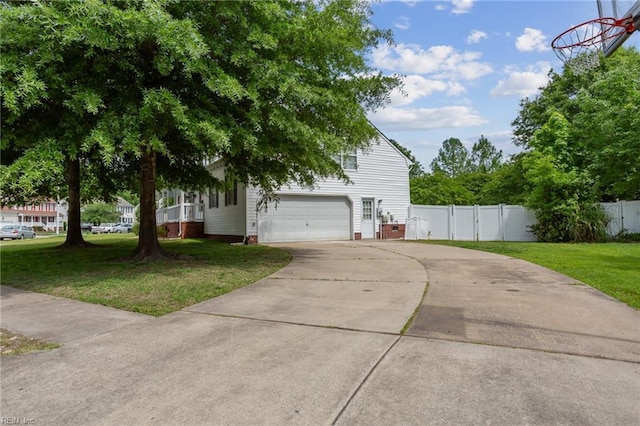 968 Speight Lyons Loop, Chesapeake, VA 23322 - view of side of home with driveway, a garage, and a gate