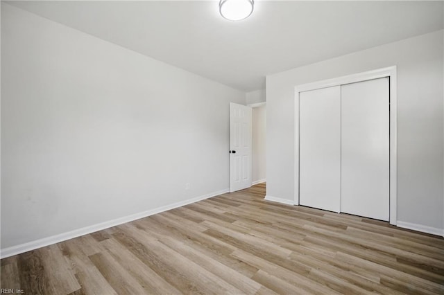 1133 Saint Julian Dr, Chesapeake, VA 23323 - unfurnished bedroom with wood finished floors, baseboards, and a closet